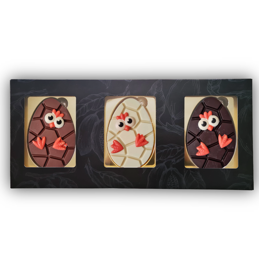 trio wikkel met chocolade paas ei en kuiken decoratie melk wit en puur